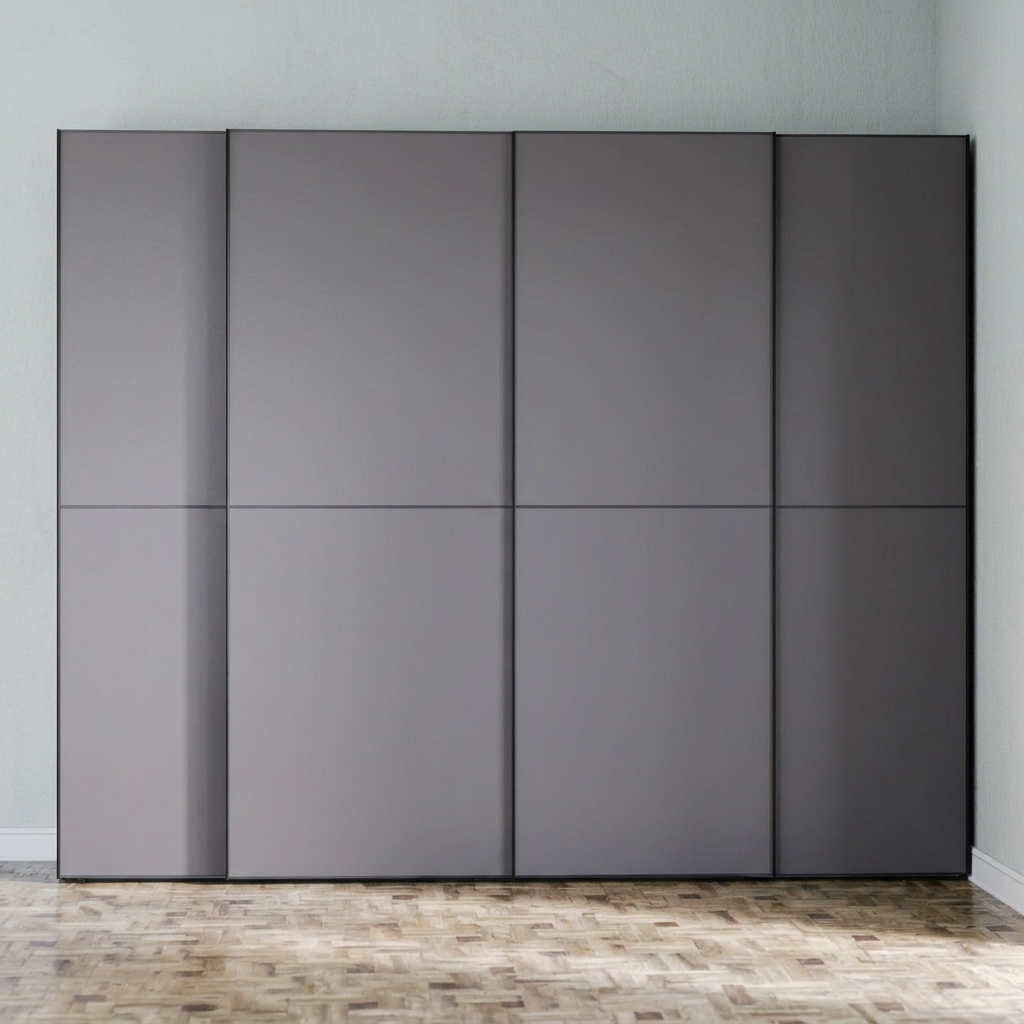 A modern six-panel sliding wardrobe or closet door system in a matte dark gray finish, set against a light gray wall and a light wood parquet floor.