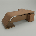 A modern wooden desk with a unique curved, sculptural design and a rich wood grain finish, shown on a neutral gray background.