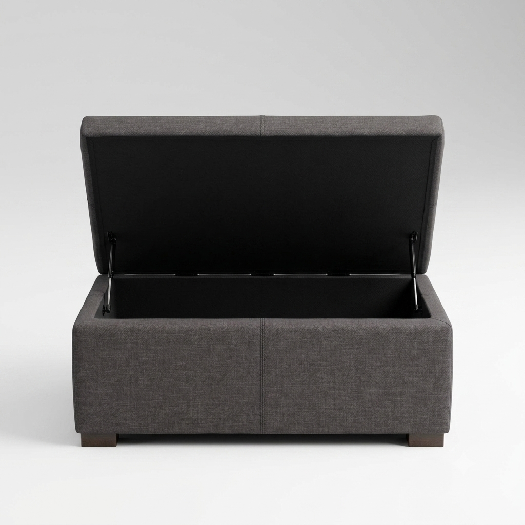 A dark gray upholstered storage bench with its lid open, showing a black interior storage compartment, photographed on a light gray studio background.