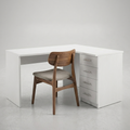 A modern L-shaped white desk with a four-drawer cabinet on the right side and a wooden chair with a gray upholstered seat, set against a neutral light gray background.